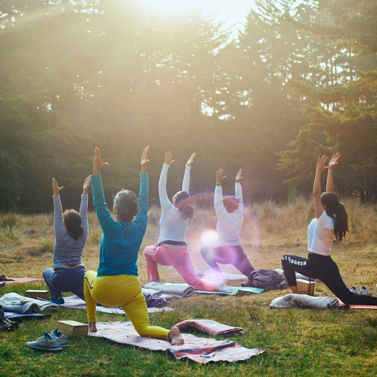 group of people raising their hands